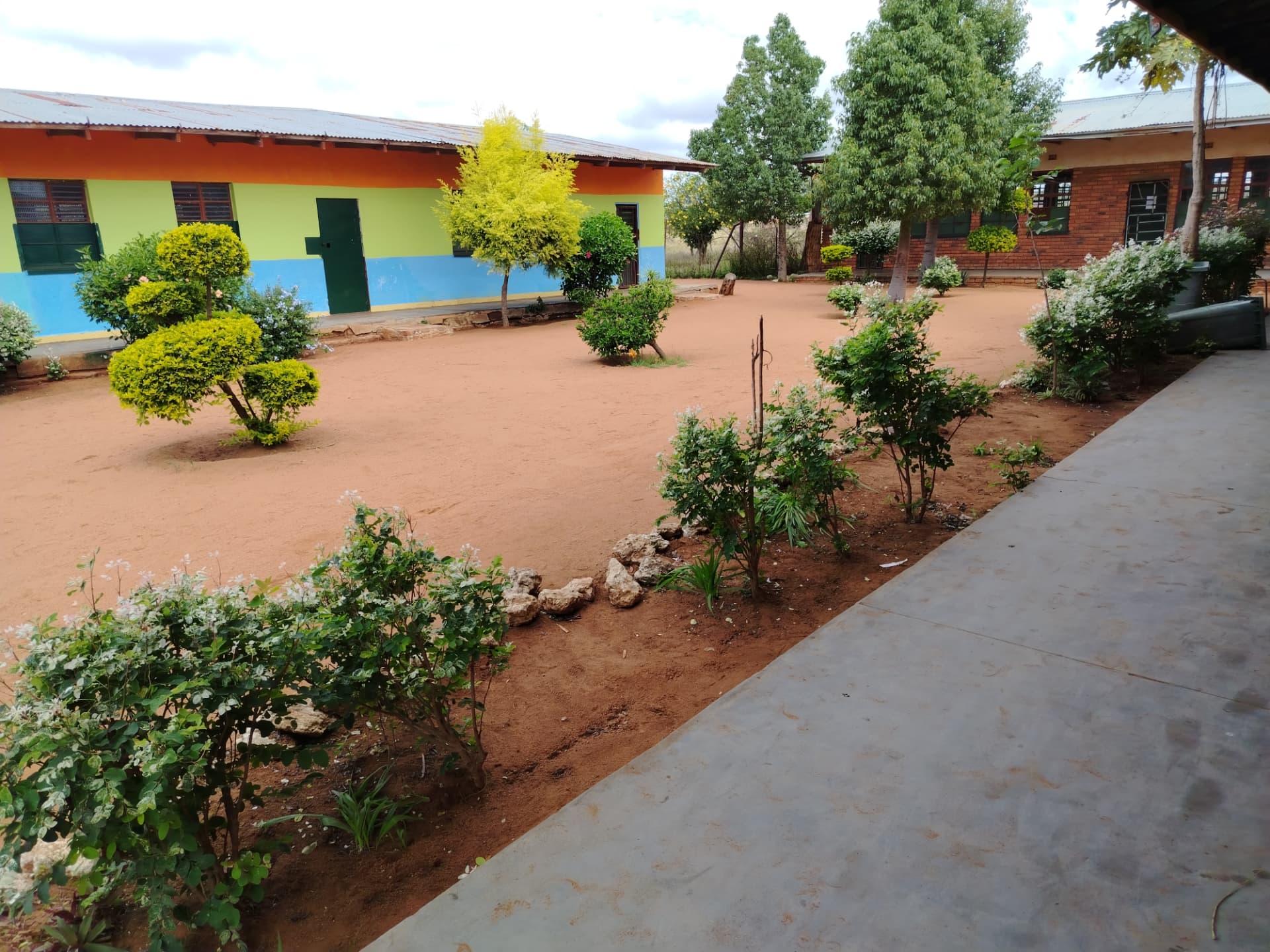 School gardens and colourful classroom buildings at Nong Modikwa Primary School